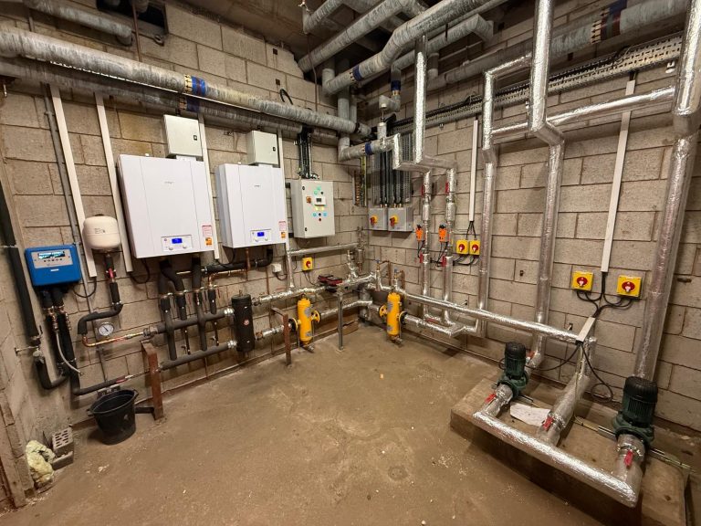 room with pipes and control boxes